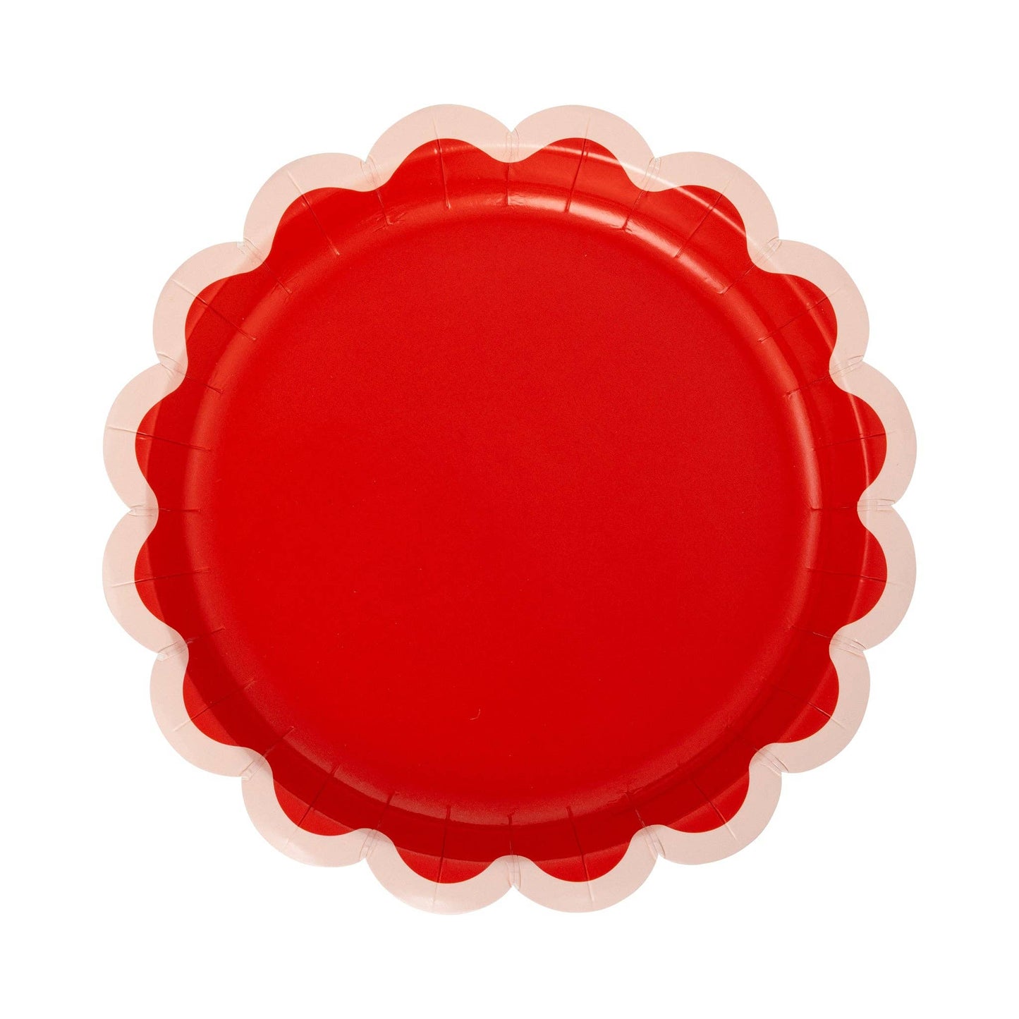 Red paper plate with scalloped edge on a white background