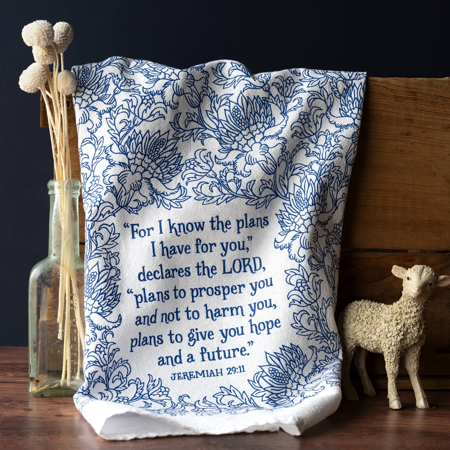 Folded tea towel with belly band packaging featuring Jeremiah 29:11 and floral accents