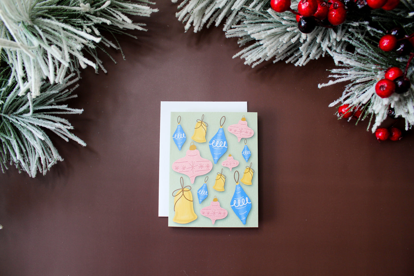 Spread some retro holiday cheer with our Christmas greeting card featuring illustrated vintage Christmas ornaments.