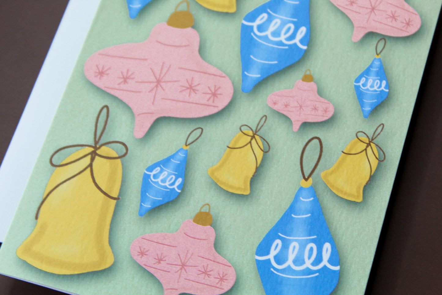 Spread some retro holiday cheer with our Christmas greeting card featuring illustrated vintage Christmas ornaments.