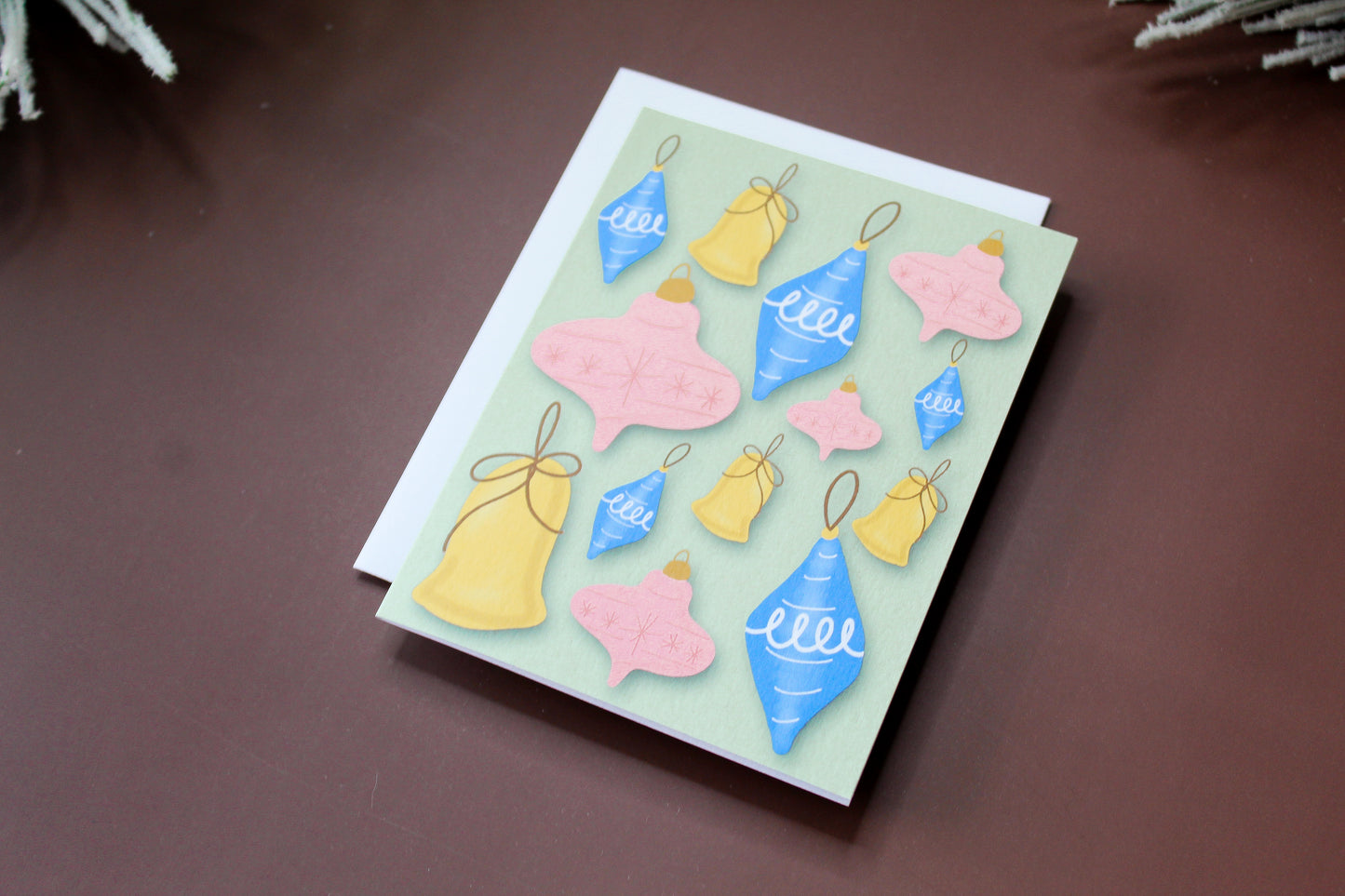 Spread some retro holiday cheer with our Christmas greeting card featuring illustrated vintage Christmas ornaments.