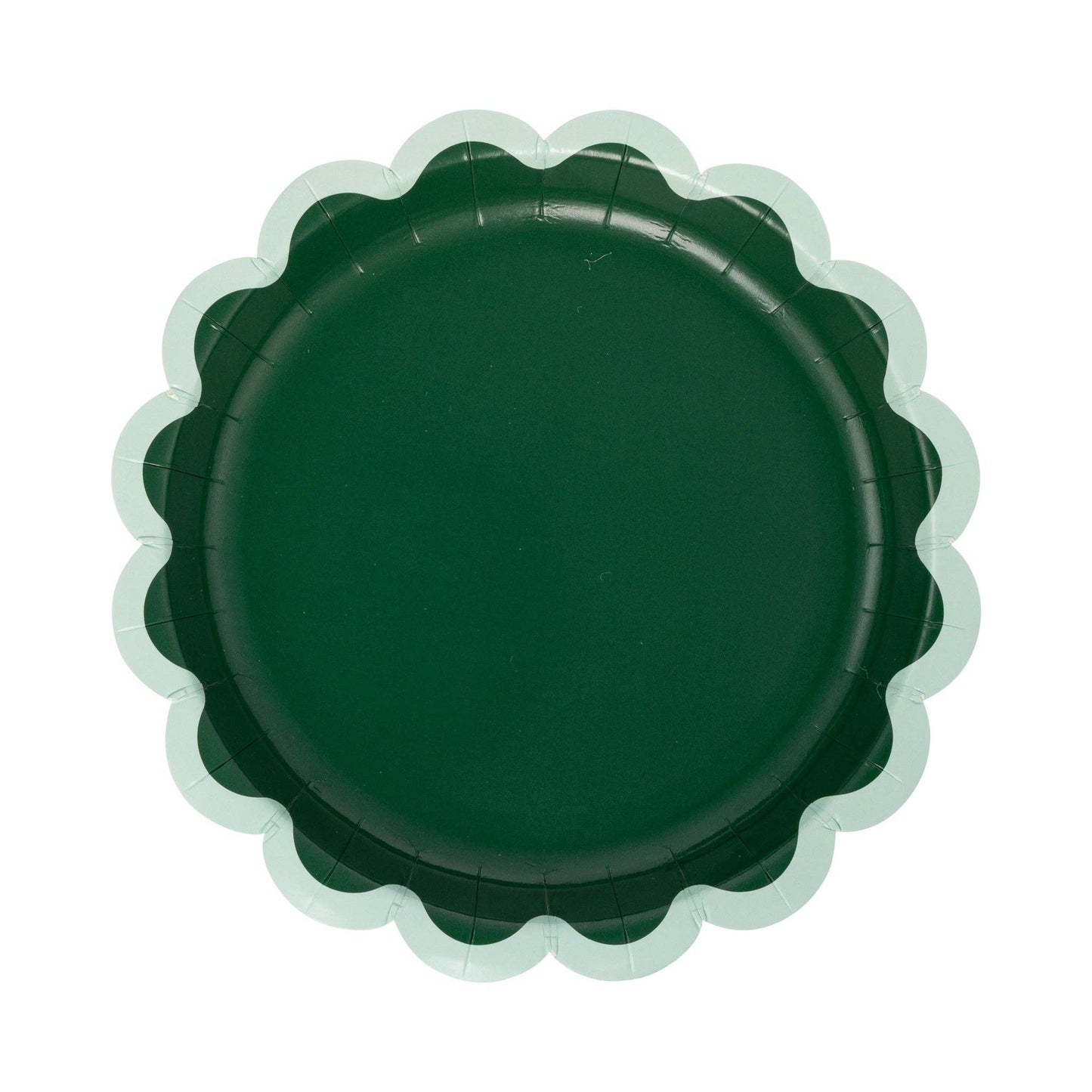 Green scalloped-edge plate on a white background