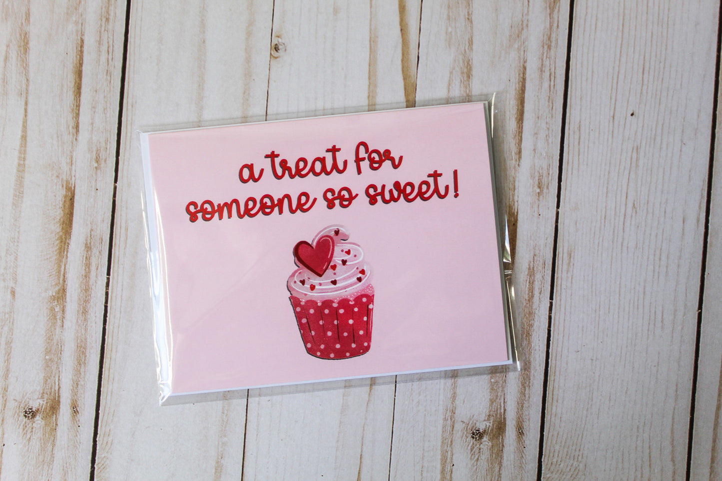 A Treat For Someone So Sweet' card showcases an adorable cupcake design set against a lovely pink background. These cards are meticulously folded to a size of 4.25" in height by 5.5" in width, offering a blank interior, greeting card