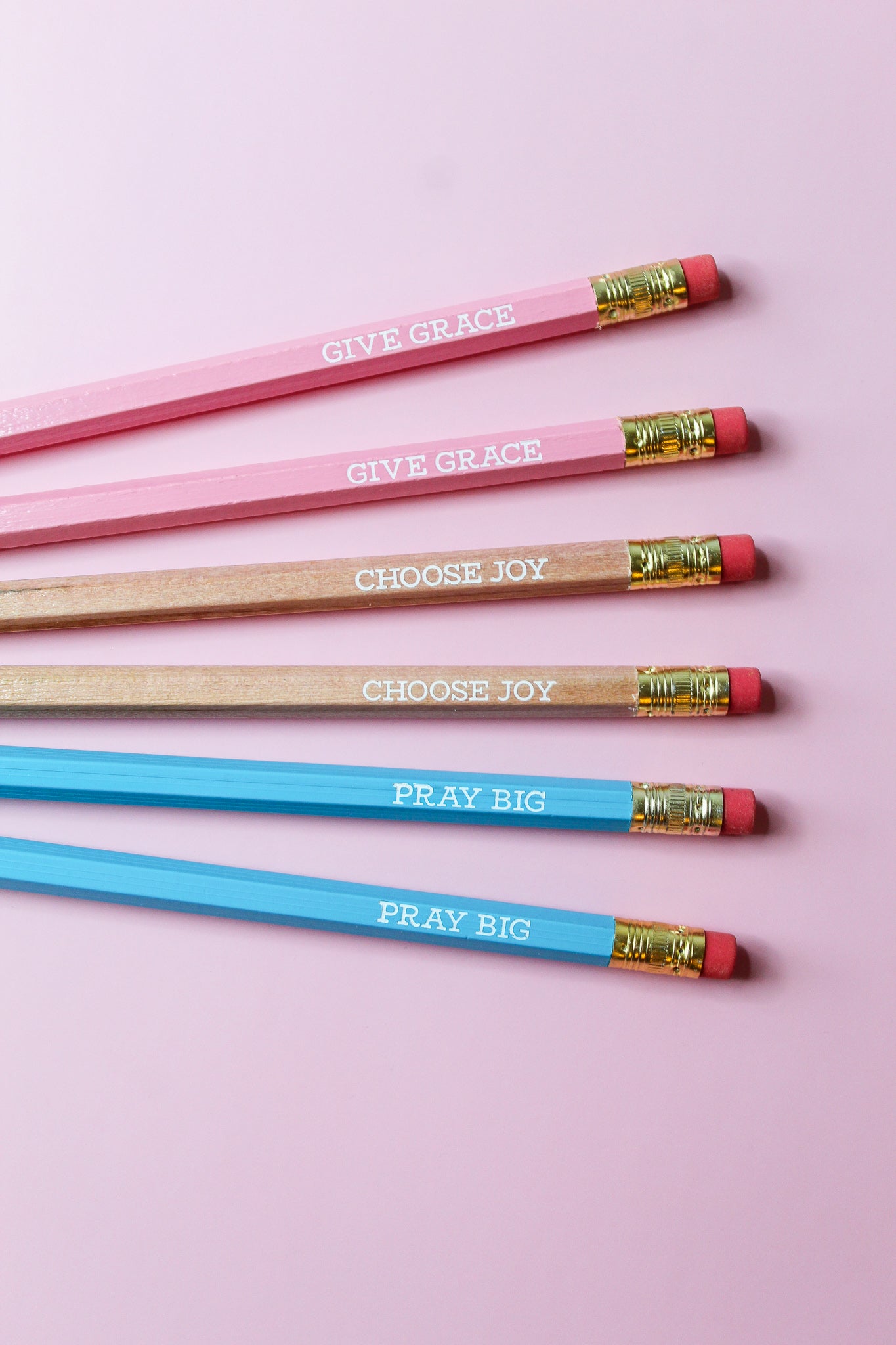 Give Grace, Choose Joy, Pray Big Pencil Set is a hopeful Pencil Set that has six pencils: two pink pencils imprinted with "give grace", two natural wood pencils imprinted with "choose joy" and two blue pencils imprinted with "pray big. 