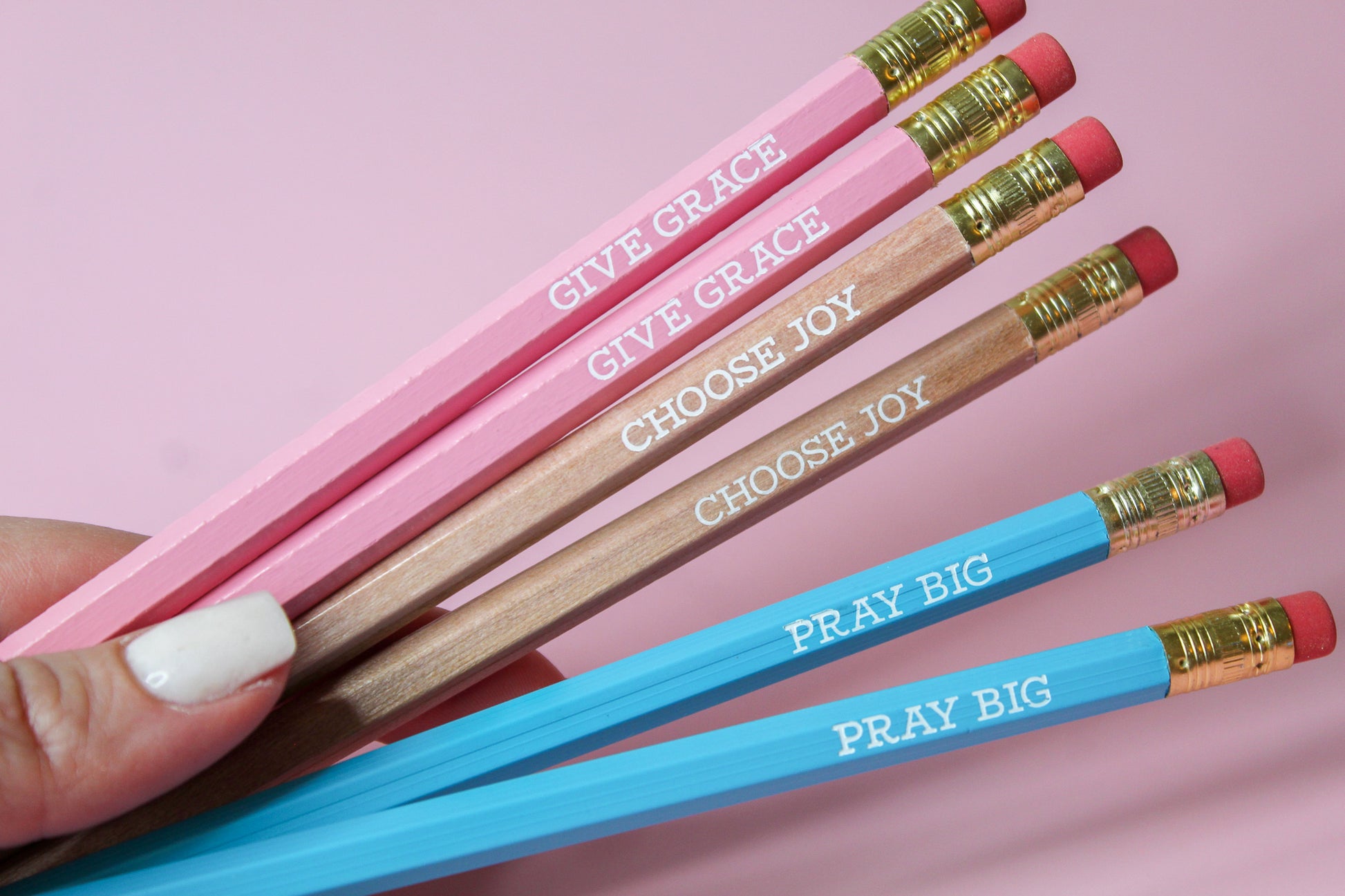 Give Grace, Choose Joy, Pray Big Pencil Set is a hopeful Pencil Set that has six pencils: two pink pencils imprinted with "give grace", two natural wood pencils imprinted with "choose joy" and two blue pencils imprinted with "pray big. 