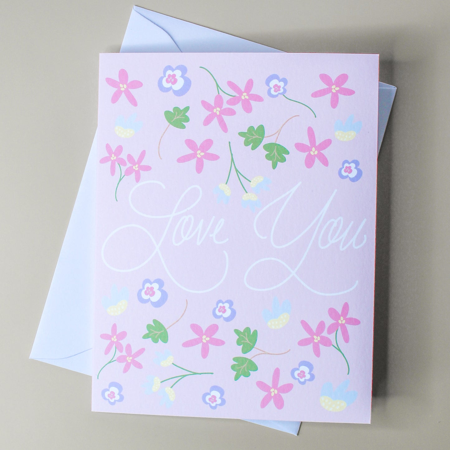 Our "Love You" card is the perfect card for an anniversary, wedding, valentines day - or a "just because" card! Each card is folded to 4.25" tall by 5.5" wide, is blank inside and comes with a matching white envelope. Cards are packaged in cellophane sleeves.