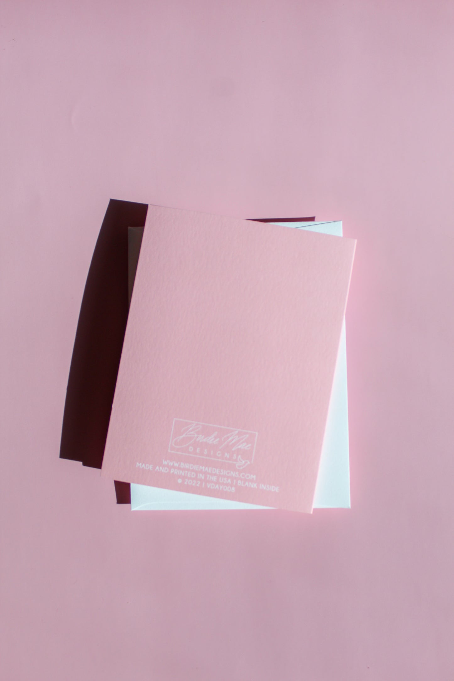 Our "Gimme Some Sugar" Valentine's Day card features hand drawn kissy lips on a pink background - it is perfect for a kid or adult! Each card is folded to 4.25" tall by 5.5" wide, is blank inside and comes with a matching white envelope. Cards are packaged in cellophane sleeves.