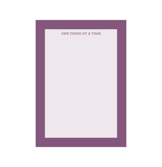 One Thing At A Time' notepads, purple notepad
