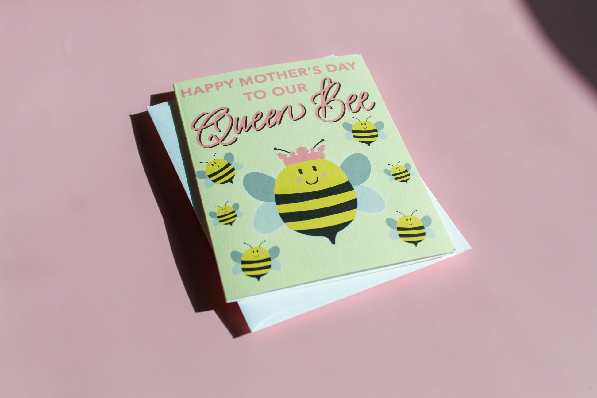 Our "Happy Mother's Day to our Queen Bee!" Mother's Day card features hand drawn queen bees on a yellow background - it is perfect for a mom, grandmother or any matriarch! Each card is folded to 4.25" tall by 5.5" wide, is blank inside and comes with a matching white envelope. Cards are packaged in cellophane sleeves.