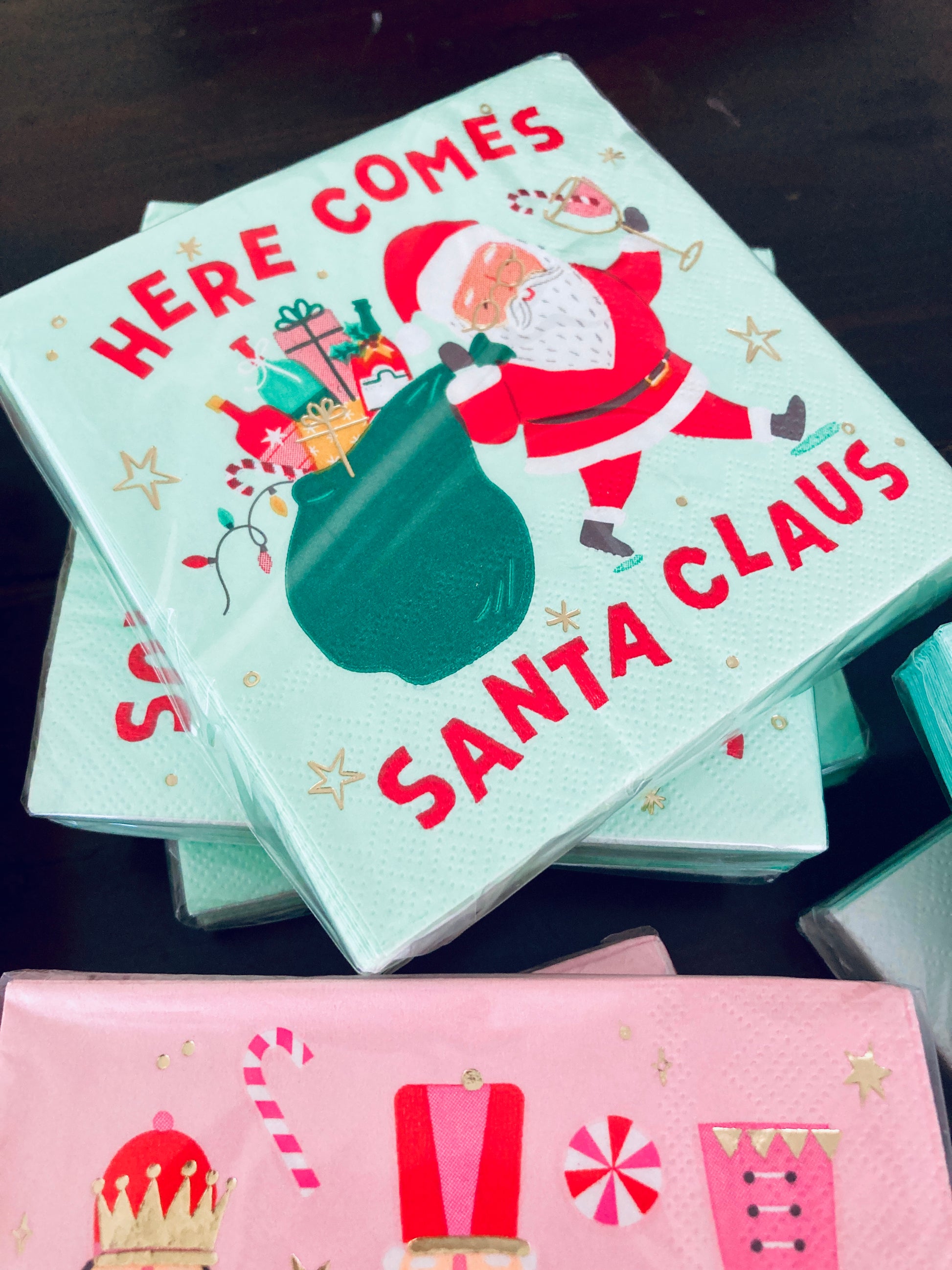 Get ready to spread some holiday cheer with Here Comes Santa Cocktail Napkins! These festive 3ply napkins feature a quirky Santa with a bag full of wine and spirits, perfect for any Christmas gathering. Each pack contains 20 napkins, measuring 5"x5", giving you plenty of napkins for all your holiday drinks. (Jolly good time guaranteed!)&nbsp;Festive Themed Beverage/Appetizer/Cocktail Napkins/Disposable Napkins for Holiday Parties and Entertainment 20ct Dimensions: 3 ply 5" x 5"