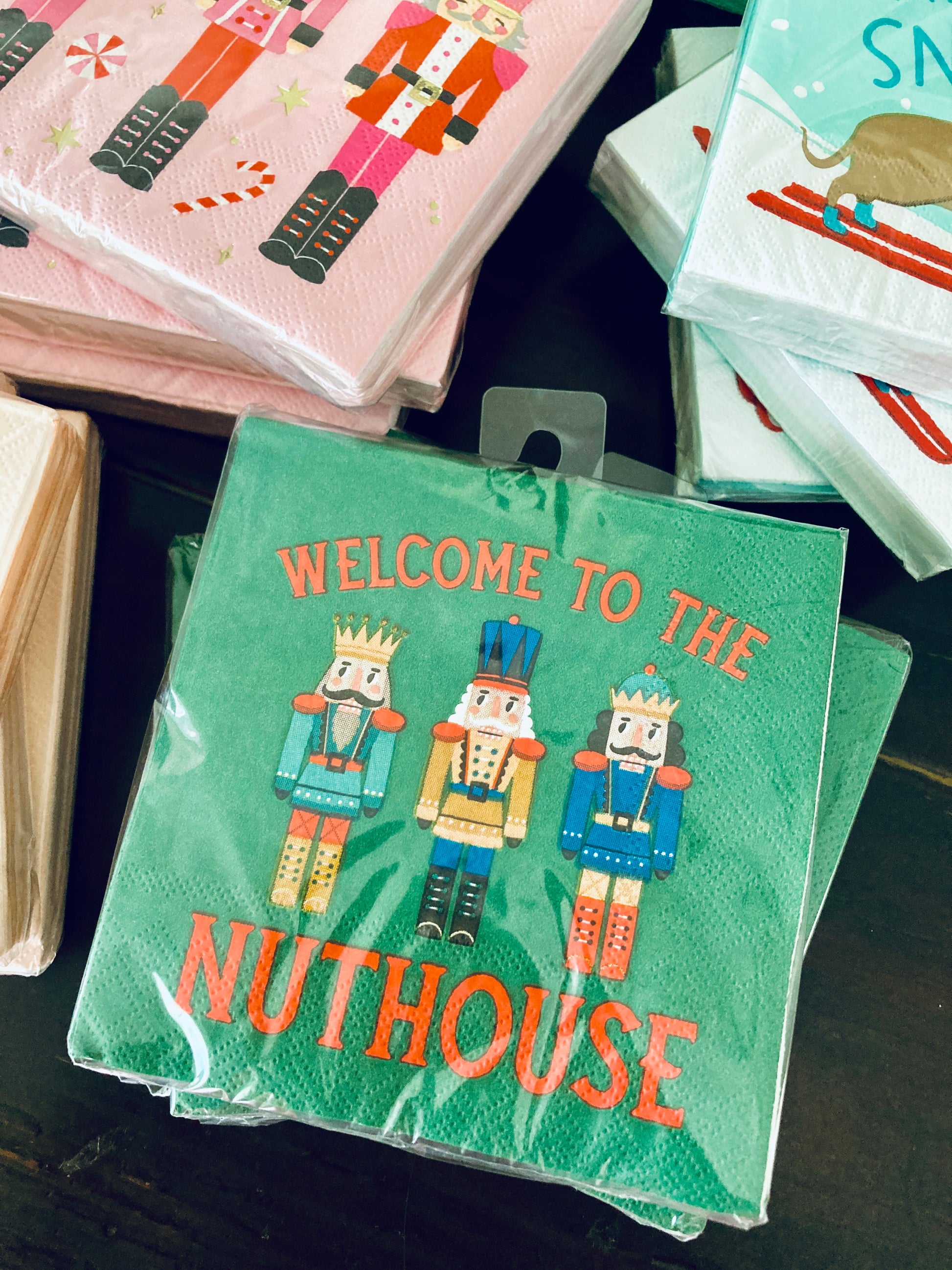 Welcome your guests to the nuttiest holiday festivities with our "Welcome to the Nuthouse" Christmas napkins. Featuring a playful picture of nutcracker men, these funny cocktail napkins are the perfect addition to any holiday party. Each set includes 20 napkins, measuring 5x5 inches. Get ready to spread some holiday cheer (and a few laughs) with these quirky and festive napkins! Beverage/Appetizer/Cocktail Napkins/Disposable Napkins for Holiday Parties and Entertainment 20ct Dimensions: 3 ply 5" x 5"