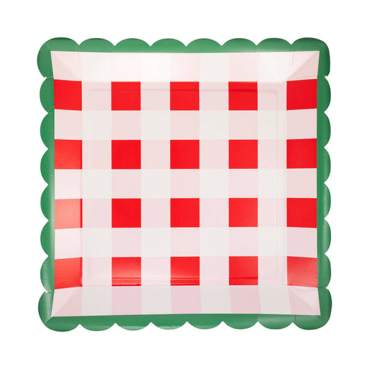 Checkered paper plate with red and white squares and green border on a white background