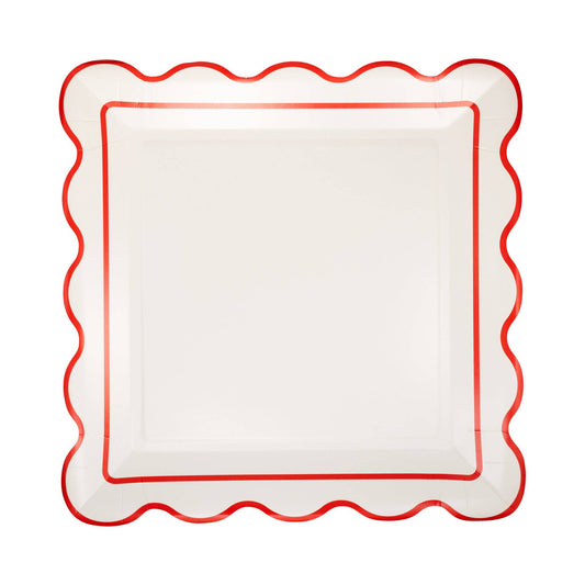 white christmas paper plate with red border and scalloped edge
