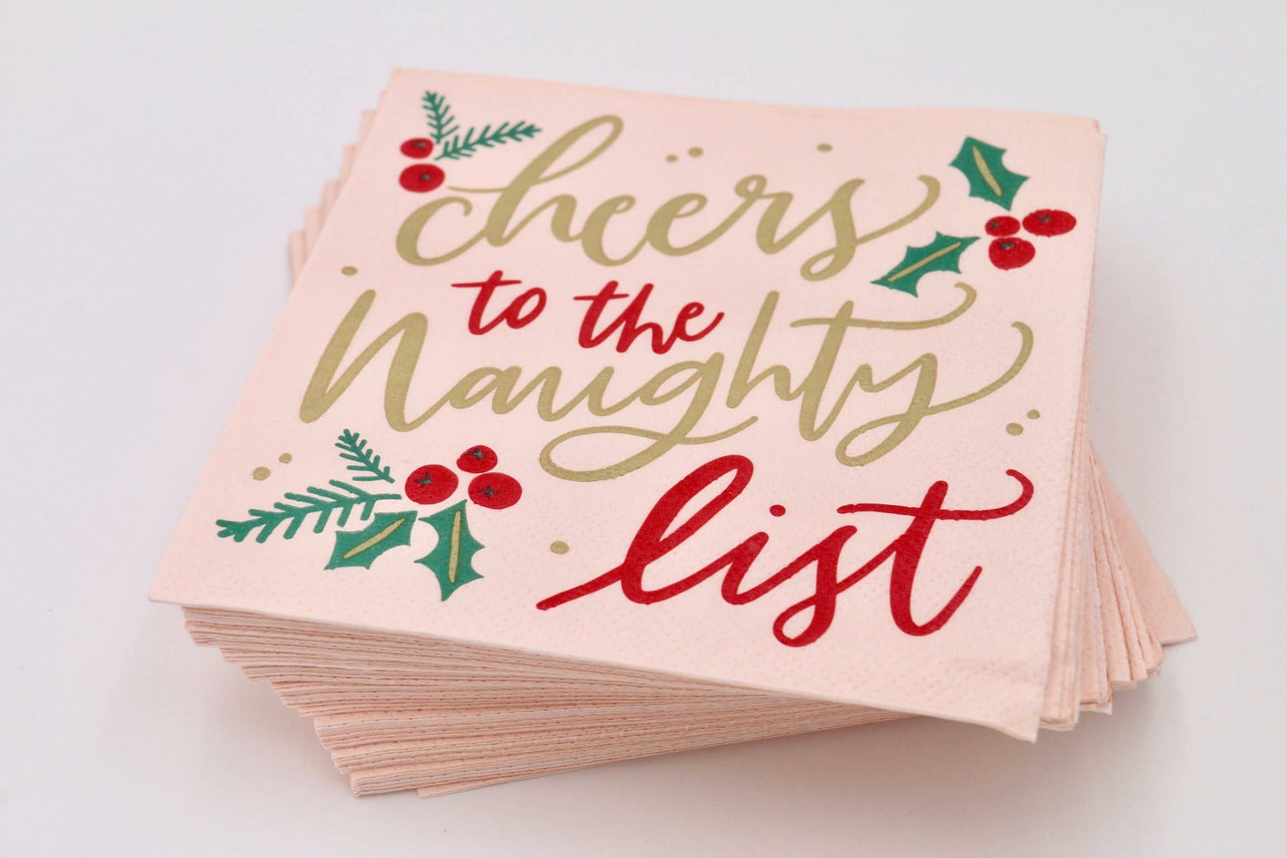 Get ready for some festive fun with Cheers to the Naughty List cocktail napkins! With 20 napkins in each pack, you'll have plenty to go around. These 3ply napkins are 5"x5" and perfect for spicing up your holiday party. Don't worry about being on the naughty list, just cheers your way through with these funny napkins!&nbsp;Festive Themed Beverage/Appetizer/Cocktail Napkins/Disposable Napkins for Holiday Parties and Entertainment 20ct Dimensions: 3 ply 5" x 5"
