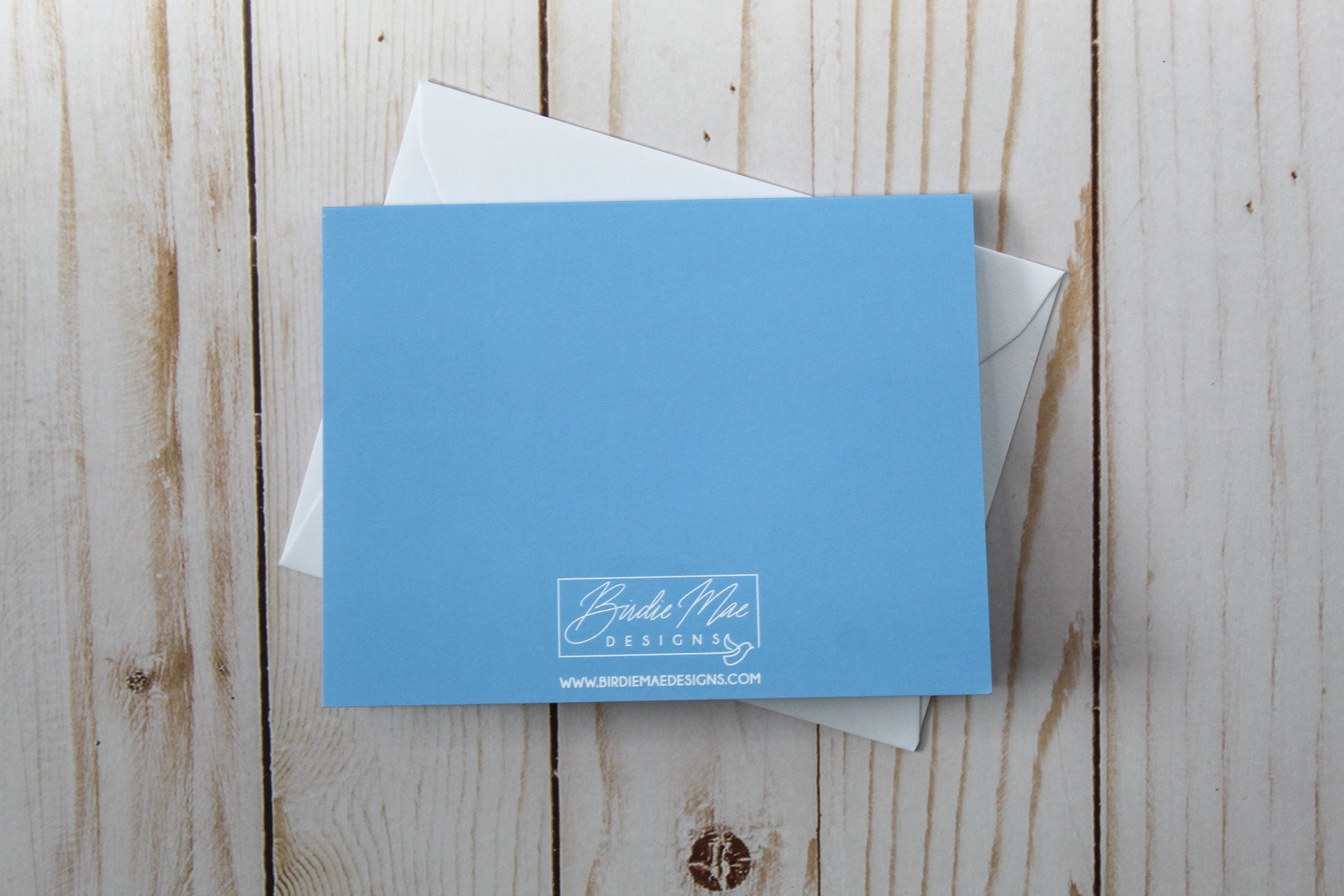 'A Treat For Someone So Sweet' card boasts a charming cupcake design against a blue backdrop. These cards are thoughtfully folded to a size of 4.25" in height by 5.5" in width, leaving the inside blank for your personal message.