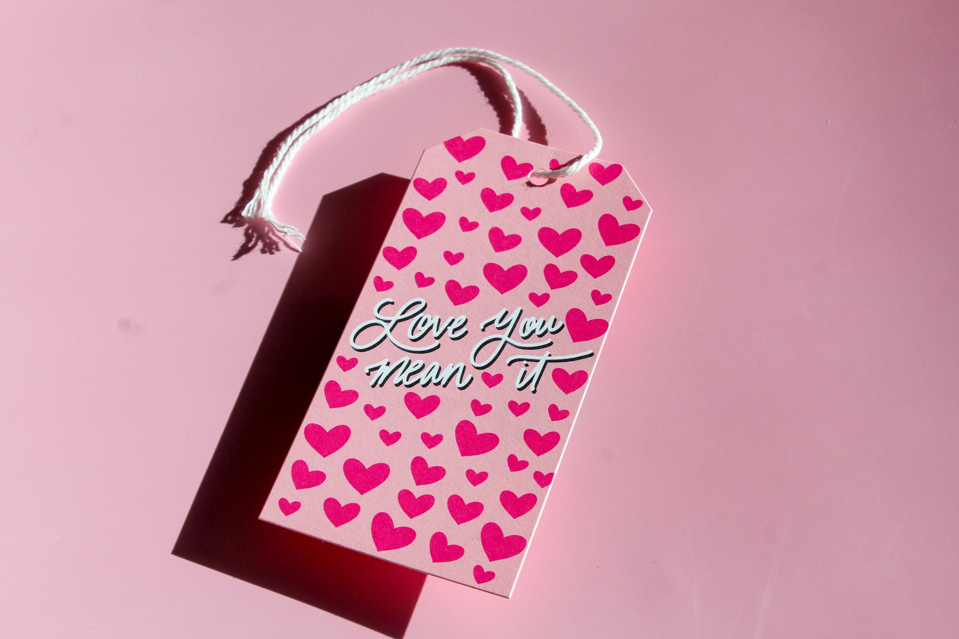 "Love You, Mean It!" Valentine tags come in sets of eight and include white string. 